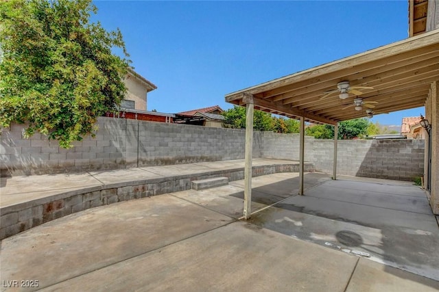 view of patio featuring ceiling fan and a fenced backyard