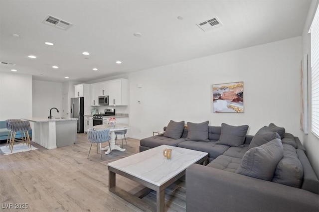 4526 Cloudrest Peak St, North Las Vegas, NV 89031 - living room featuring light wood finished floors and recessed lighting