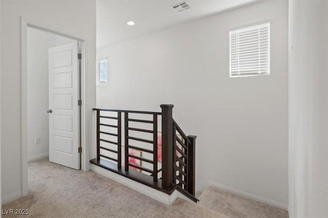 stairway with carpet, baseboards, and recessed lighting