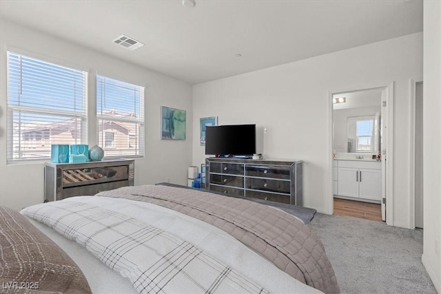 4526 Cloudrest Peak St, North Las Vegas, NV 89031 - carpeted bedroom featuring a sink and ensuite bath