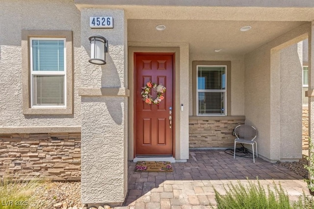 4526 Cloudrest Peak St, North Las Vegas, NV 89031 - property entrance featuring stucco siding and stone siding