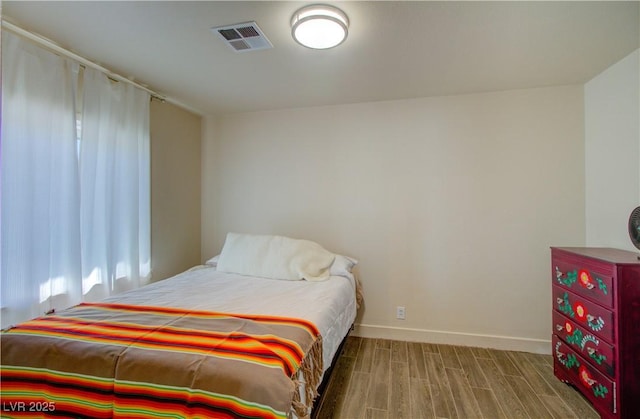 533 Date St, Boulder City, NV 89005 - bedroom featuring baseboards and wood finish floors