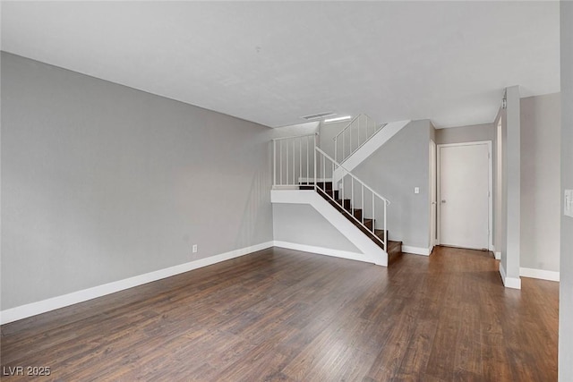 4339 Spencer St Unit 15, Las Vegas, NV 89119 - unfurnished living room with wood finished floors, baseboards, and stairs