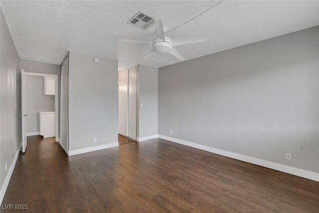 4339 Spencer St Unit 15, Las Vegas, NV 89119 - spare room with a ceiling fan, dark wood finished floors, and baseboards