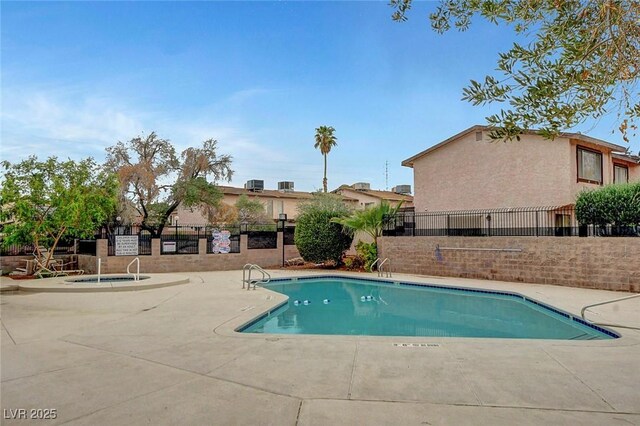 4339 Spencer St Unit 15, Las Vegas, NV 89119 - community pool featuring fence and a patio