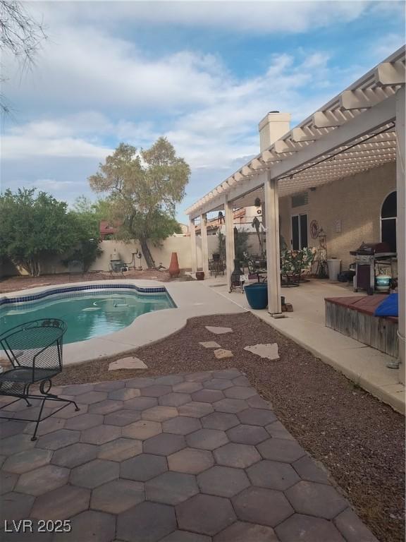 7894 W Patrick Ln, Las Vegas, NV 89113 - view of pool featuring a patio, a pergola, a fenced backyard, and a grill