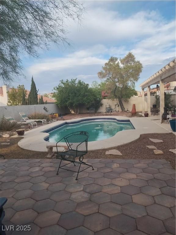 view of swimming pool featuring a patio area and a fenced backyard