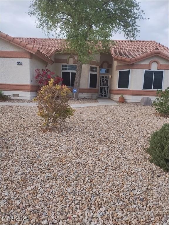 7894 W Patrick Ln, Las Vegas, NV 89113 - mediterranean / spanish house with a tile roof and stucco siding