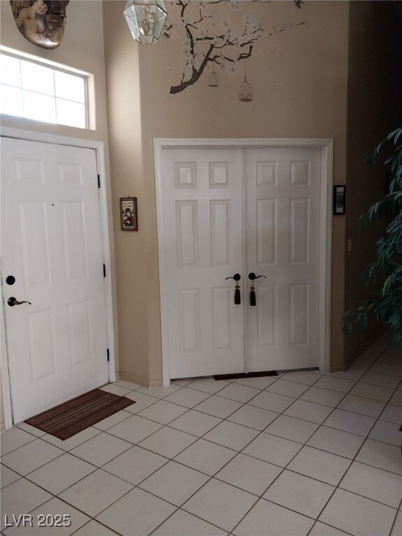 foyer with light tile patterned flooring