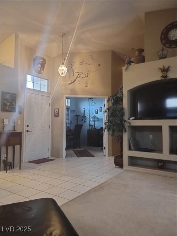 7894 W Patrick Ln, Las Vegas, NV 89113 - entryway with tile patterned floors and a towering ceiling