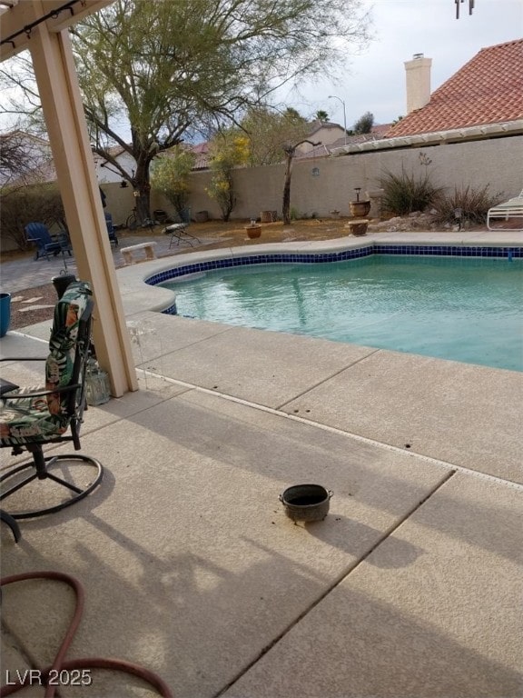 7894 W Patrick Ln, Las Vegas, NV 89113 - view of swimming pool with a patio and a fenced backyard