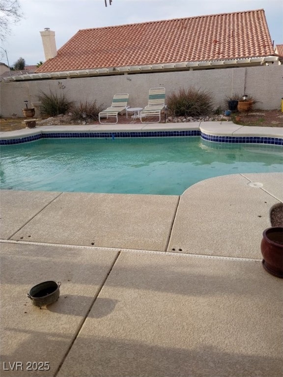 7894 W Patrick Ln, Las Vegas, NV 89113 - view of pool featuring a fenced backyard and a patio area