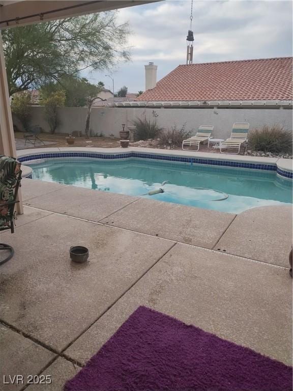 7894 W Patrick Ln, Las Vegas, NV 89113 - view of pool with a patio and a fenced backyard