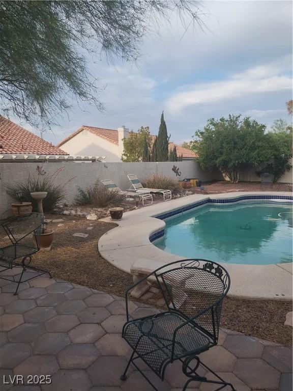 7894 W Patrick Ln, Las Vegas, NV 89113 - view of pool featuring a fenced backyard and a patio area