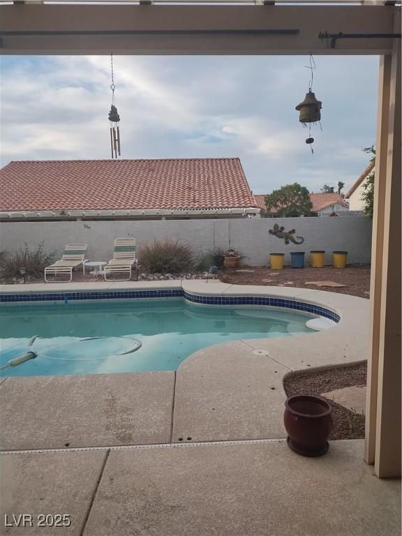 7894 W Patrick Ln, Las Vegas, NV 89113 - view of pool featuring a fenced backyard and a patio