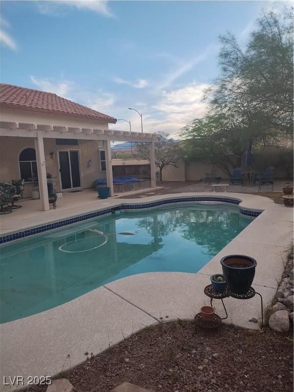 7894 W Patrick Ln, Las Vegas, NV 89113 - swimming pool with a patio, a jacuzzi, and fence