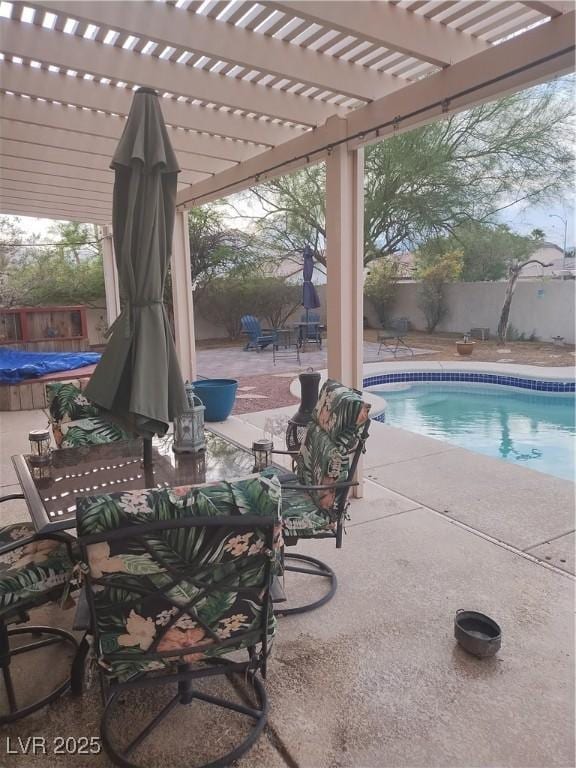 7894 W Patrick Ln, Las Vegas, NV 89113 - view of swimming pool with a fenced backyard, a pergola, a patio, and outdoor dining area
