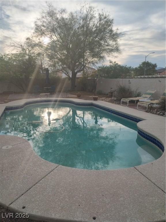 7894 W Patrick Ln, Las Vegas, NV 89113 - view of pool with a patio and a fenced backyard