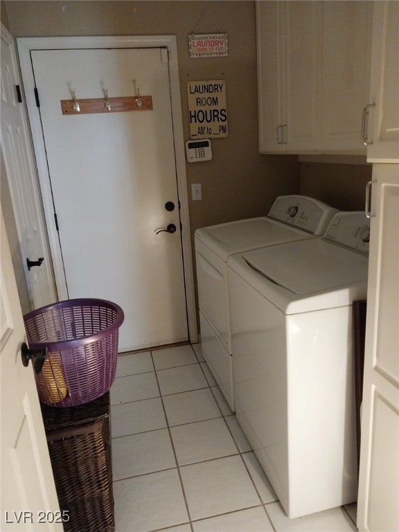 7894 W Patrick Ln, Las Vegas, NV 89113 - washroom featuring washing machine and dryer, cabinet space, and light tile patterned floors