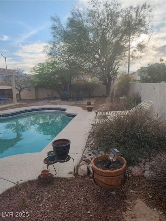 7894 W Patrick Ln, Las Vegas, NV 89113 - view of pool featuring a fenced backyard and a patio area