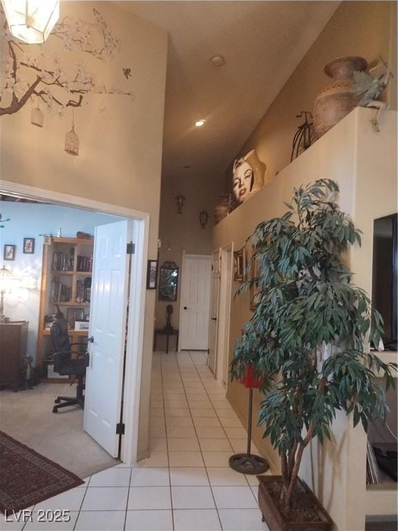7894 W Patrick Ln, Las Vegas, NV 89113 - corridor with a desk, light tile patterned flooring, a high ceiling, and recessed lighting
