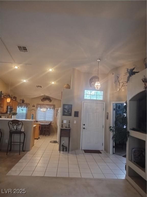 7894 W Patrick Ln, Las Vegas, NV 89113 - foyer entrance featuring lofted ceiling and light tile patterned floors