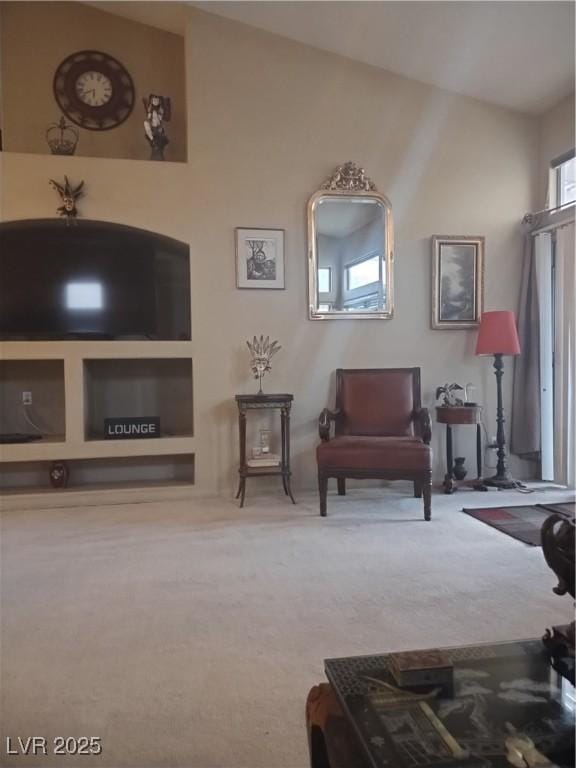 7894 W Patrick Ln, Las Vegas, NV 89113 - living area featuring carpet floors and healthy amount of natural light