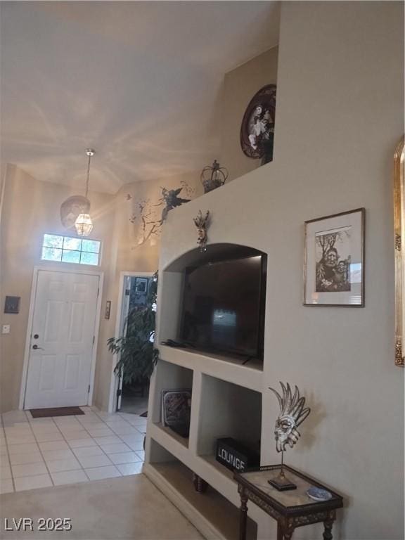 7894 W Patrick Ln, Las Vegas, NV 89113 - entryway featuring light tile patterned flooring and lofted ceiling