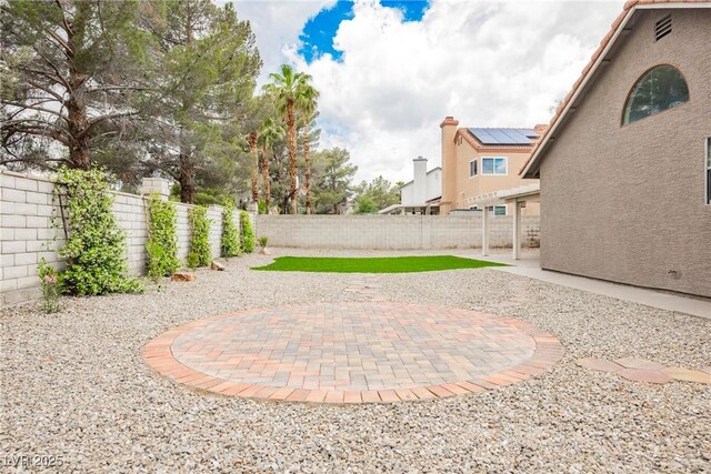 fenced backyard featuring a patio