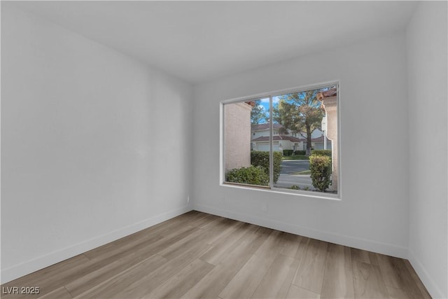 6940 Emerald Springs Ln, Las Vegas, NV 89113 - empty room featuring light wood-style flooring and baseboards