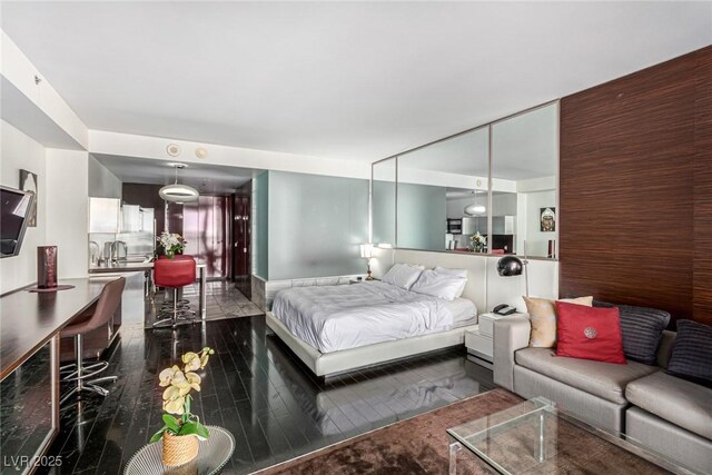 bedroom with wood-type flooring