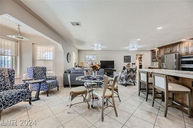 5202 Willis St, North Las Vegas, NV 89031 - dining area featuring a textured ceiling, light tile patterned flooring, and recessed lighting