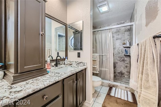 5202 Willis St, North Las Vegas, NV 89031 - full bathroom featuring toilet, a shower stall, vanity, tile patterned flooring, and a textured ceiling