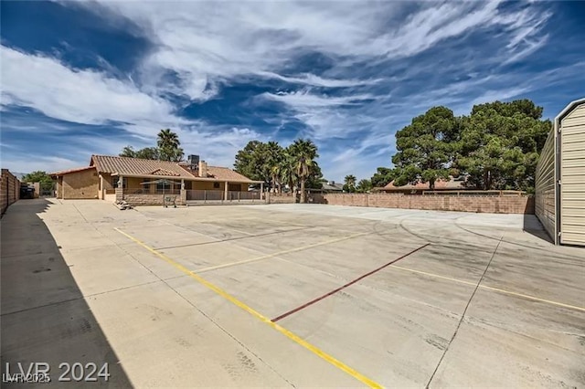 5202 Willis St, North Las Vegas, NV 89031 - view of sport court with fence