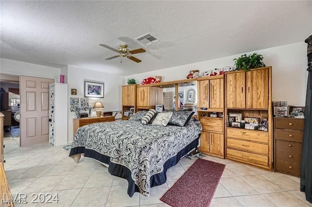 5202 Willis St, North Las Vegas, NV 89031 - bedroom featuring a textured ceiling and light tile patterned floors