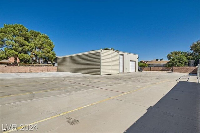 5202 Willis St, North Las Vegas, NV 89031 - exterior space featuring a detached garage and fence