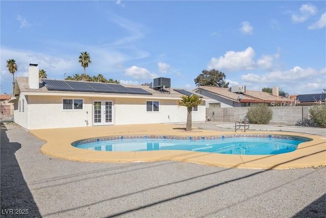 1616 Yellow Rose St, Las Vegas, NV 89108 - view of pool featuring french doors, cooling unit, a patio area, and a fenced backyard