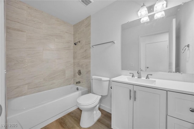 1616 Yellow Rose St, Las Vegas, NV 89108 - full bathroom with wood finished floors, toilet, vanity, and  shower combination