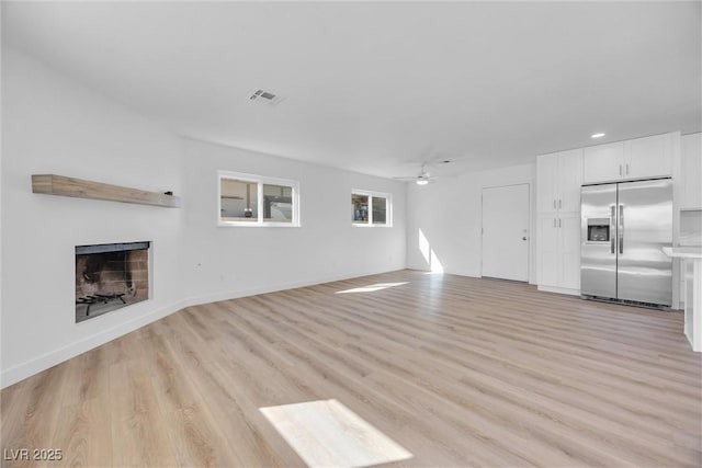 1616 Yellow Rose St, Las Vegas, NV 89108 - unfurnished living room featuring ceiling fan, a fireplace, light wood-type flooring, recessed lighting, and baseboards
