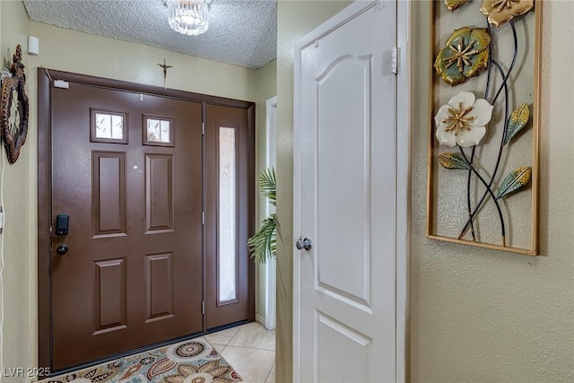 604 N Torrey Pines Dr, Las Vegas, NV 89107 - entryway featuring light tile patterned floors, a textured ceiling, and a textured wall
