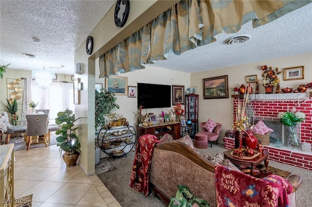 604 N Torrey Pines Dr, Las Vegas, NV 89107 - living room with a textured ceiling, light tile patterned floors, and a brick fireplace
