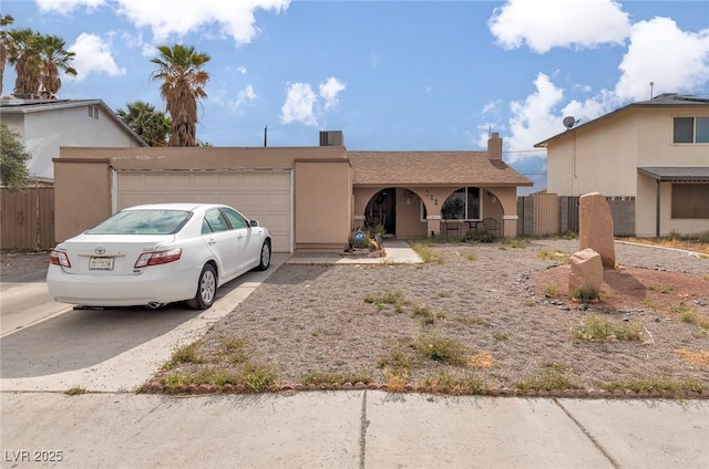 604 N Torrey Pines Dr, Las Vegas, NV 89107 - single story home with an attached garage, concrete driveway, stucco siding, and fence