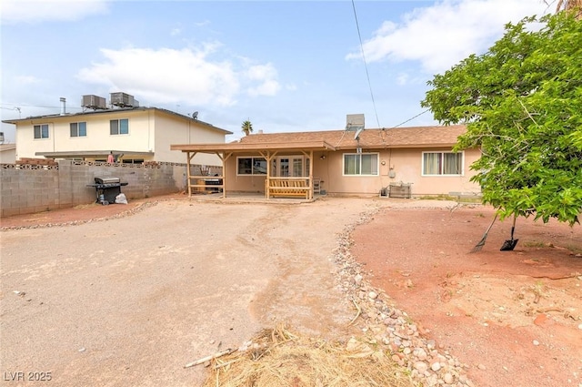 604 N Torrey Pines Dr, Las Vegas, NV 89107 - rear view of house featuring fence and stucco siding