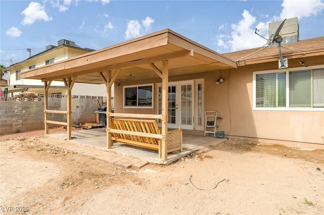 604 N Torrey Pines Dr, Las Vegas, NV 89107 - back of property with a patio, fence, and stucco siding