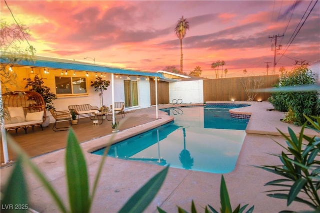 2043 Sombrero Dr, Las Vegas, NV 89169 - view of swimming pool featuring a patio area, a fenced backyard, and an outdoor hangout area