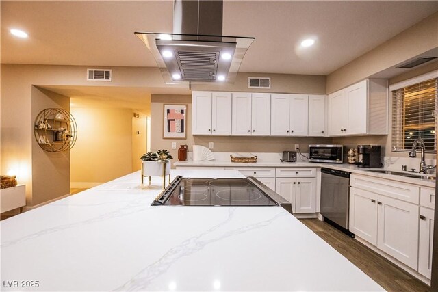2043 Sombrero Dr, Las Vegas, NV 89169 - kitchen with a sink, stainless steel appliances, white cabinetry, light stone counters, and dark wood-type flooring