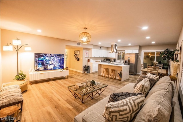 2043 Sombrero Dr, Las Vegas, NV 89169 - living area with light wood-style flooring, recessed lighting, and baseboards