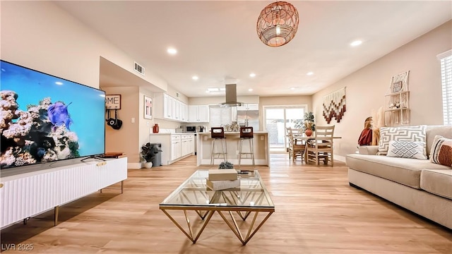 2043 Sombrero Dr, Las Vegas, NV 89169 - living room featuring light wood-type flooring, baseboards, and recessed lighting