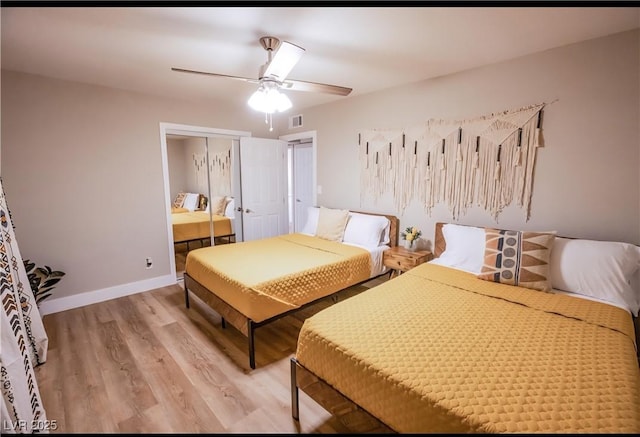 2043 Sombrero Dr, Las Vegas, NV 89169 - bedroom with light wood-type flooring, a closet, ceiling fan, and baseboards