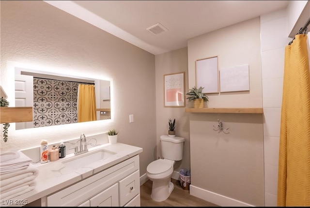 2043 Sombrero Dr, Las Vegas, NV 89169 - full bath featuring toilet, wood finished floors, vanity, and a shower with curtain